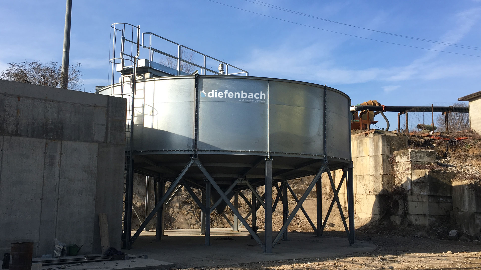 Galvanized elevated thickener sitting outdoors
